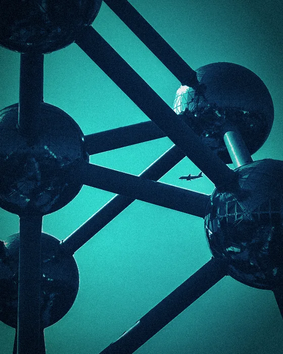 Ball-and-stick architectural model of a molecule against the sky